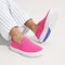 hover | Model wearing The Kids Sneaker in Bubblegum.