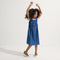 Alternate view of a model wearing The Kids Sneaker in Desert Cat.