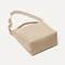 The Bucket Bag in Knot Brown shown laid down.