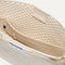 The Bucket Bag in White Sand close up of interior zipper pocket.