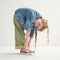 Alternate view of a model wearing The Kids Strap Sneaker in Cat Blush. 