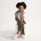 Alternate image of a child modeling The Kids Strap Sneaker in Pink Taffy. 