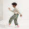 Alternate image of a child modeling The Kids Strap Sneaker in Pink Taffy. 