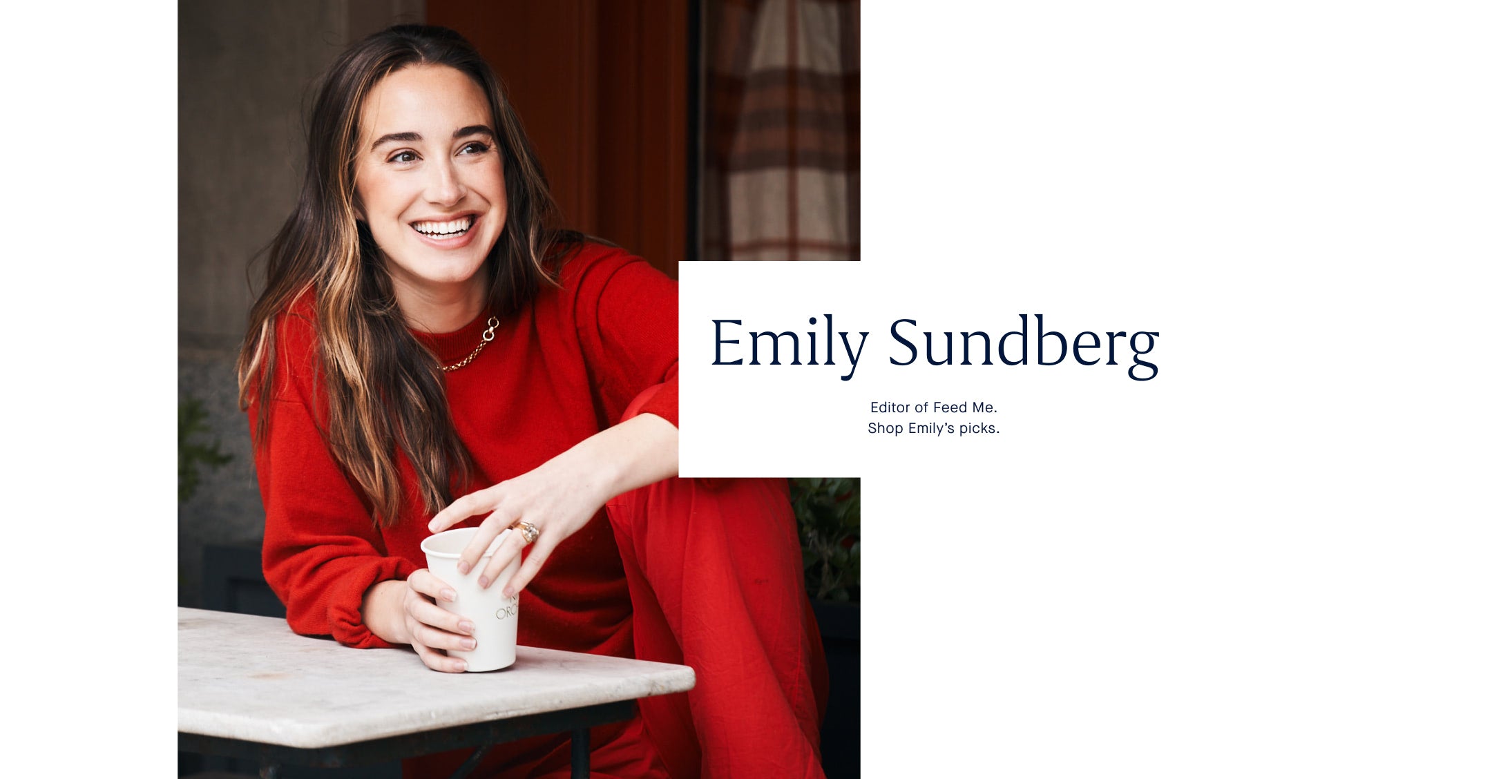 Woman in red sweater holding a white mug with 'Emily Sundberg' text overlay