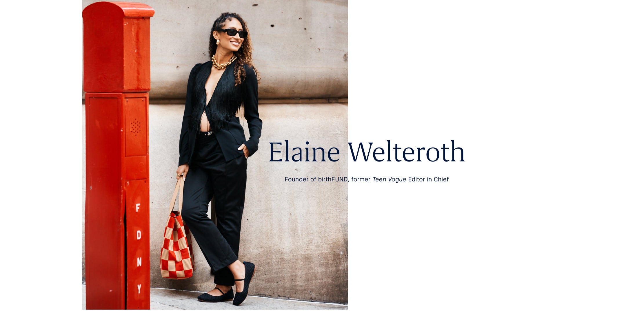 Woman in The Mary Jane in Black standing next to a red mailbox with 'Elaine Welteroth' text.