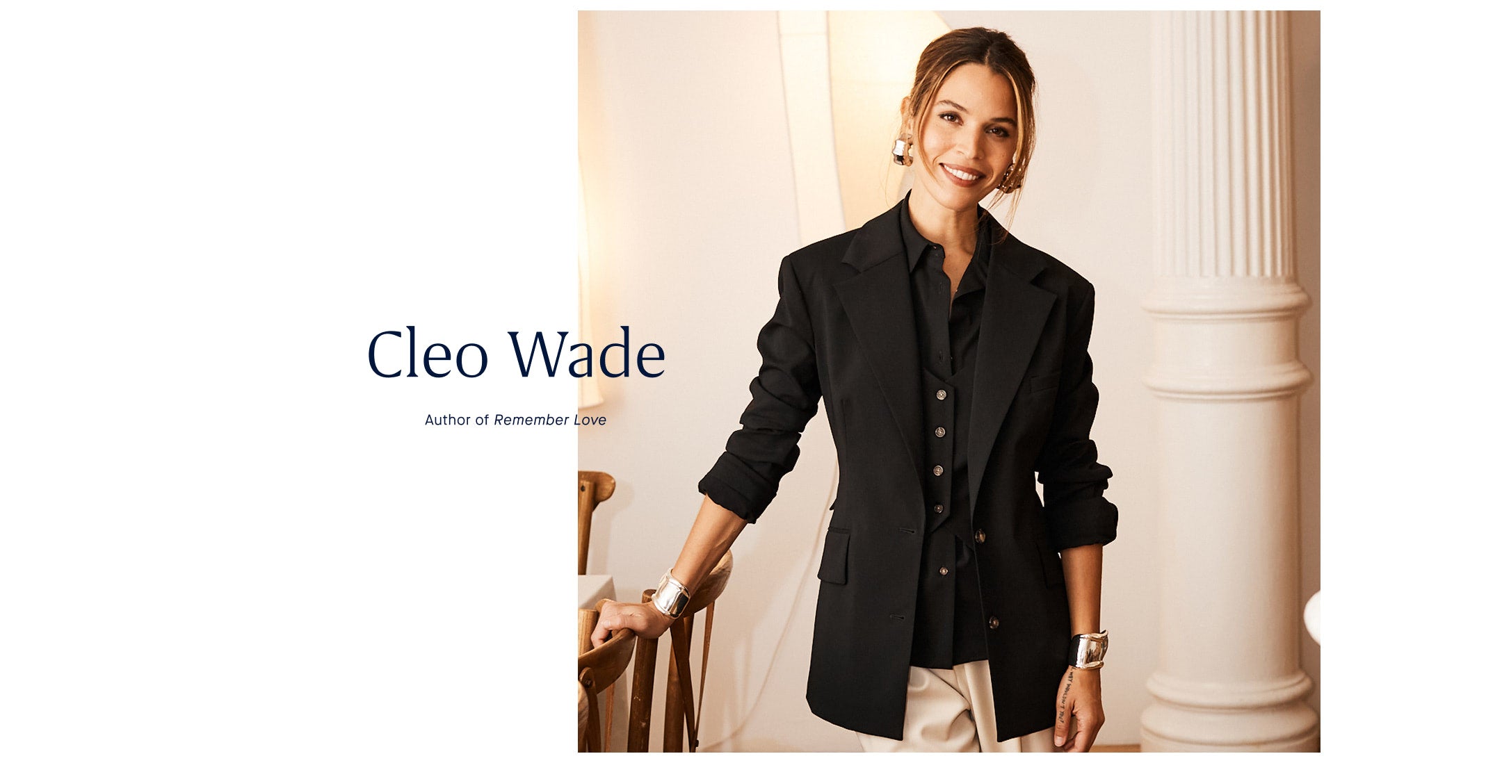 Woman wearing a black coat with 'Cleo Wade' and 'Author of Remember Love' text at the bottom.