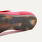 The sole of The Square Mary Jane in Lollipop Red shown in diagonal view. 