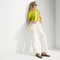 hover | The Mini Zip Bucket in White Sand, carried over the shoulder of a female model, shown from the front.
