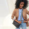 hover | Model wearing The Shoulder Strap in Black Chain paired with The Daily Crossbody.
