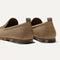 Close up of the heel of The Ravello Loafer in Faded Brown, with Rothy's signature blue halo on the pull tab.