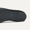 Close up of the outsole of The Point II in Black Bouclé, shown in a diagonal view. 