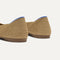 Close up of the heel of The Point II in Tan Woven, with Rothy's signature blue halo. 