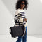 hover | Overlay:: Shown with The Classic Tote (sold separately.) | Alt::The Crossbody Strap in Black and White Stripe, shown paired with The Classic Tote, worn by a model, shown from the side
