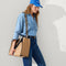 hover | Overlay:: Shown with The Classic Tote (sold separately) | Alt::The Crossbody Strap in Desert Cat, shown paired with The Classic Tote, worn by a model, shown from the side