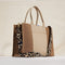 hover | Overlay:: Shown with The Classic Tote (sold separately) | Alt::The Crossbody Strap in Desert Cat, shown paired with The Classic Tote, worn by a model, shown from the side