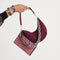 The Shoulder Strap in Golden Silver Chain paired with The Mini Crescent Bag and The Wallet Wristlet.