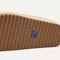 Close up of the outsoles of The Casual Clog in Pelican Raffia-Knit.