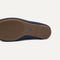 Close up of the outsoles of The Double Bit Loafer Mule in Blue Raffia-Knit. 