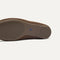 Close up of the outsoles of The Double Bit Loafer Mule in Cinnamon Raffia-Knit. 