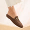 hover | Model wearing The Double Bit Loafer Mule in Cinnamon Raffia-Knit. 