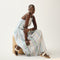 Alternate view of a model wearing The T-Strap Sandal in Cream Puff.