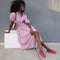 Another view of a model wearing The Cruiser Loafer in Fuchsia Bloom.
