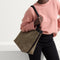 hover | Model holding The Lightweight Zip Tote in Cacao Herringbone. 