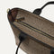 The Lightweight Zip Tote in Cacao Herringbone focusing on the zip closure and handles