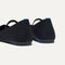Close up of the heel of The Max Square Mary Jane in Black, with Rothy's signature blue halo.
