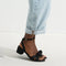 hover | Model wearing The Knot Sandal in Black.