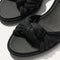 Close up of the knot detail of The Knot Sandal in Black.