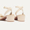 Close up of the heel of The Knot Sandal in Conch.