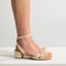 hover | Model wearing The Knot Sandal in Conch.