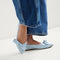 Alternate view of a model wearing The Bow Point II in Powder Blue. 