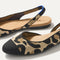 Close up of the strap on The Almond Slingback in Desert Cat, with Rothy's signature blue halo.