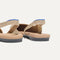 Close up of the heel The Almond Slingback in Metallic Prosecco, with Rothy's signature blue halo.
