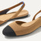 Close up of the strap on The Almond Slingback in Tawny Captoe, with Rothy's signature blue halo.