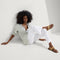 Alternate view of a model wearing The T-Strap Sandal in Metallic Golden Sun.