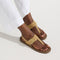 hover | Model wearing The T-Strap Sandal in Metallic Golden Sun. 