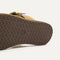 Close up of the outsole of The T-Strap Sandal in Metallic Golden Sun.