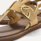 Close up of the T-strap and buckle detail of The T-Strap Sandal in Metallic Golden Sun. 