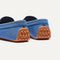 Close up of the heel of The Daily Driver in Blue Sea, with raised peg outsoles and Rothy's signature blue halo. 