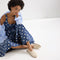 Alternate view of a model wearing The Cruiser Loafer in White Raffia-Knit. 