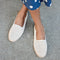 Another view of a model wearing The Cruiser Loafer in White Raffia-Knit.
