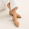 hover | Model wearing The D'Orsay Point in Camel Crochet