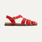 The Fisherman Sandal in Scarlet shown from the side. 