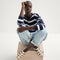 Alternate view of a model wearing The Fisherman Sandal in Coconut.