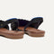 Close up of the heel The Almond Slingback in Eyelet Black.