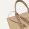 Close up of the handles and key leash detail of The Lightweight Tote in Caramel Twist. 