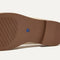 The Penny Loafer in Conch Raffia-Knit shown in diagonal view. 